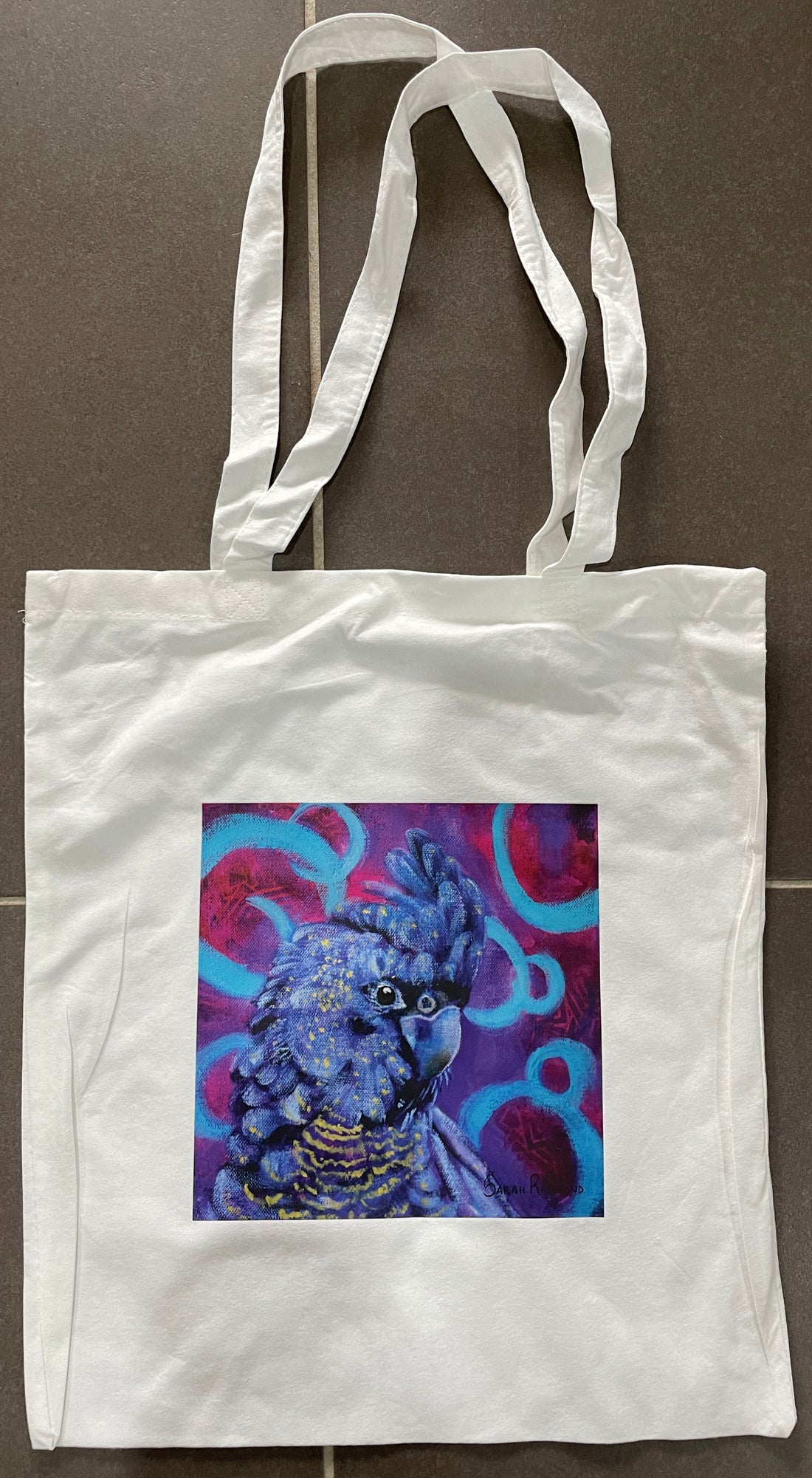 White Bamboo Tote bag with print of abstract realism black cockatoo.