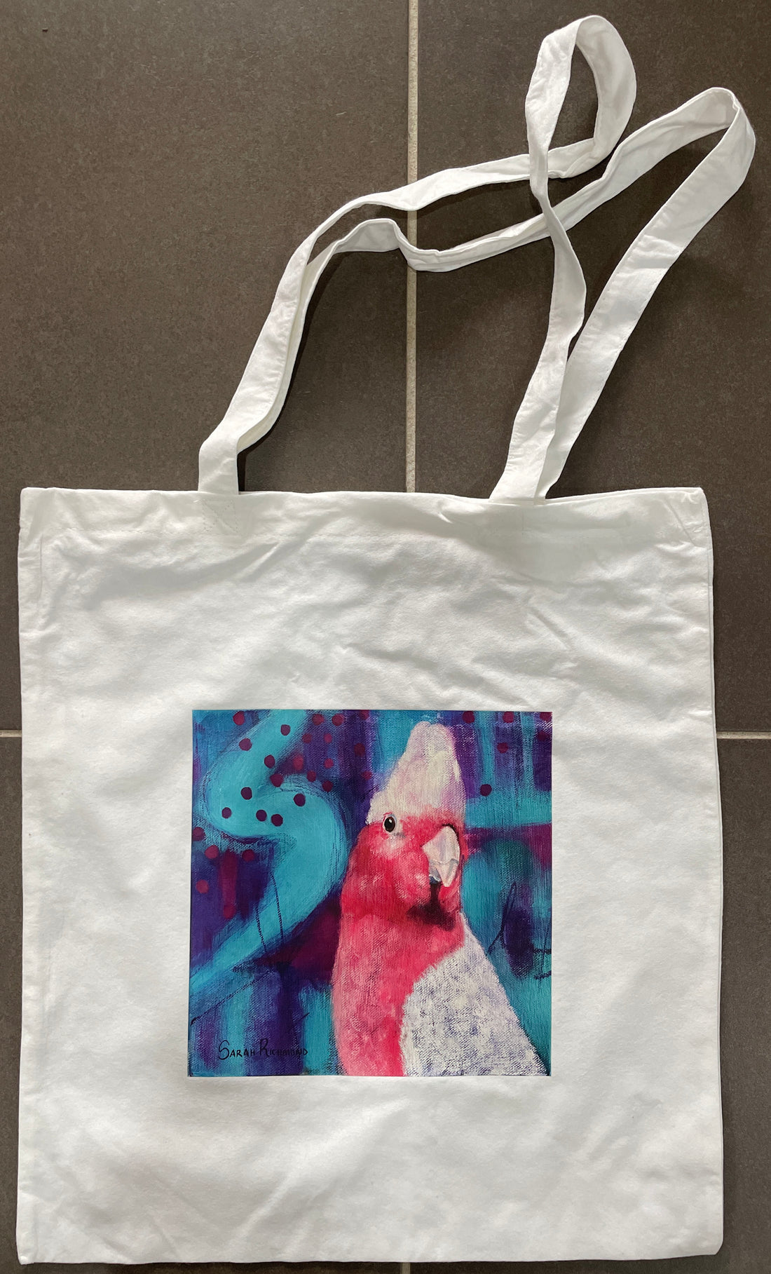 White Bamboo tote bag with print of abstract realism galah on abstract background.